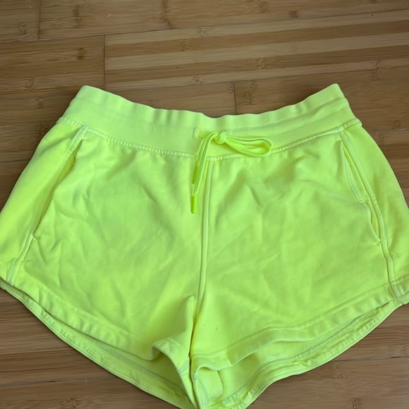 Lululemon inner Glow High rise neon yellow sweat pant shorts - Picture 2 of 10